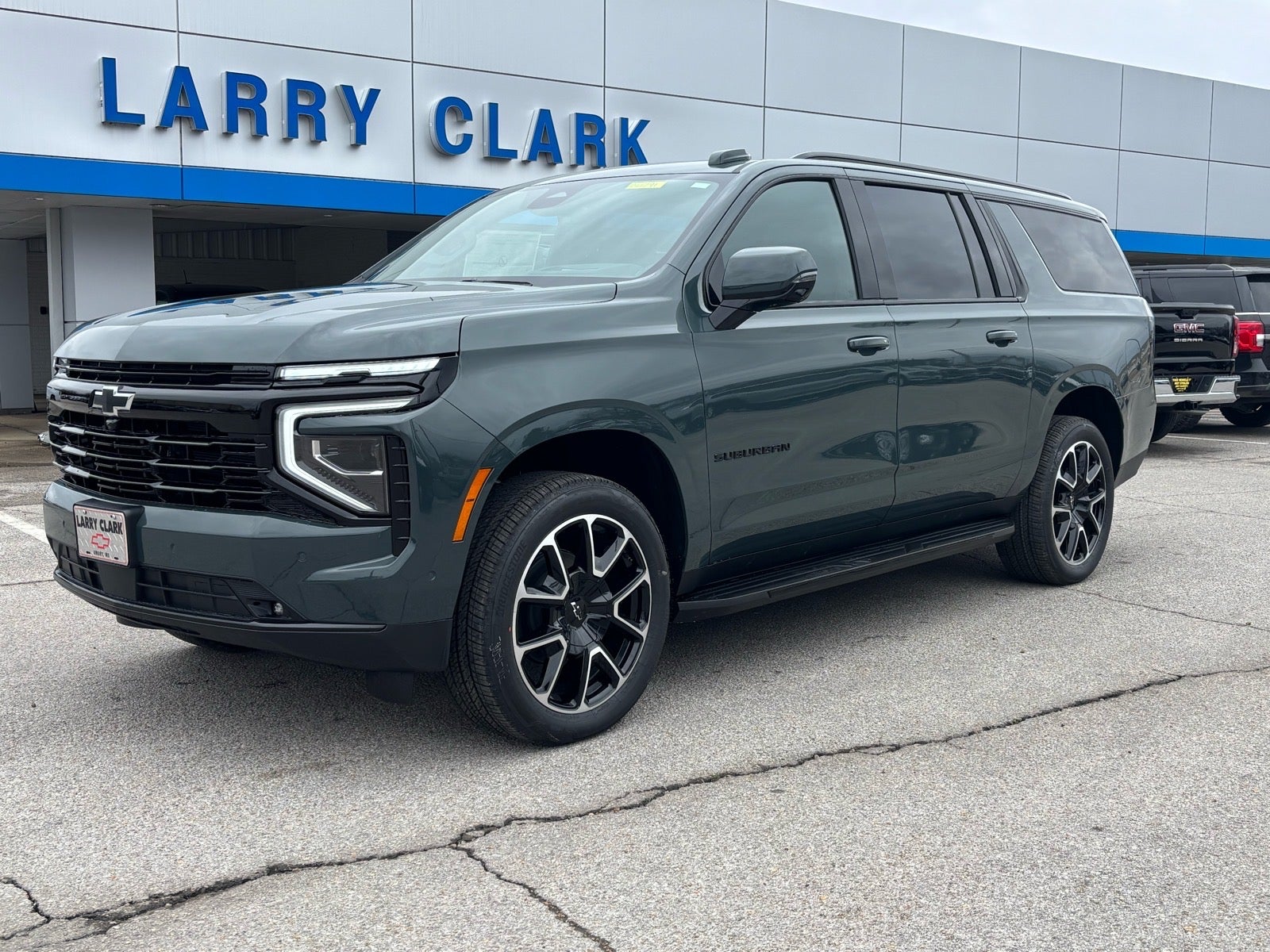 2026 Chevrolet Suburban RST in Cypress Gray — front three-quarter view