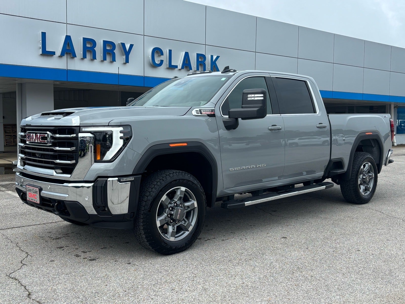 2025 GMC Sierra 2500 HD SLE in Thunderstorm Gray — front three-quarter view