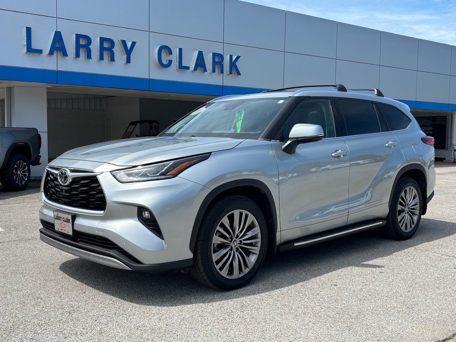 2021 Toyota Highlander Platinum in Silver — front three-quarter view